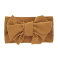 Elastic mustard yellow waffle fabric headband with a large bow for infants and newborns - Brown