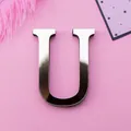 Mirror finish silver acrylic letter U wall sticker with reflective surface on pink background - Letter U