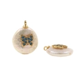 Macro shot of coin-shaped pearl pendant with gold butterfly and blue turquoise inlay - No.13 Turquoise Butterfly Pearl