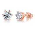 Detail of rose gold six-prong crown stud earrings featuring round brilliant cut zircons - Round 6-Prong / Rose Gold