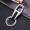 Close-up of a premium leather and metal keychain resting on a stylish magazine - Modern Minimalist Style (GX-381)