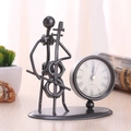 Handcrafted black iron cello player figurine desk clock featuring a vintage Roman numeral dial - C62 Cello Clock