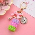 Three-layer purple macaron keychain with pink bow and golden Eiffel Tower charm - Purple Pink