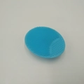 Blue oval silicone facial cleanser brush with dual-texture soft massaging bristles - Blue