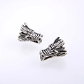 Vintage silver dragon head earrings with intricate mythological scales and carvings - Antique Silver
