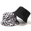 Detail of reversible bucket hat showing dollar bill print and solid black cotton fabric - M (56-58cm) / Black Reversible Dollar Graffiti