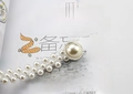 Detail of elegant pearl waist chain with rhinestone buckle and gold metal finish - Small Pearls Silver
