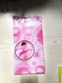 Pink polka dot exfoliating back scrubber towel in sealed retail packaging - Printed Pink