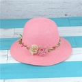 Pink straw sun hat featuring a floral wreath with green leaves and chiffon blossoms - M (56-58cm) / Pink
