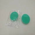Set of two mint green oval silicone face brushes with soft bristles for facial cleansing - Green