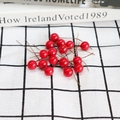 Artificial 12mm red berry branches for DIY home decor on checkered background - 12mm Red