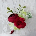 Elegant bridal boutonniere with deep red peony and roses on white lace fabric background - Vintage Red Boutonniere