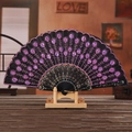 Black folding fan with pink embroidered flowers and sequins on decorative wooden stand - Pink
