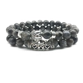 Close-up of gray stone beads with silver buddha head and hollow cloud pattern charms - Labradorite