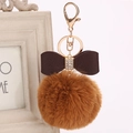 Detail of fluffy brown rabbit fur keychain with rhinestone bow and gold ring - 8cm / Khaki
