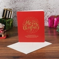 Red Christmas card with gold foil lettering and white envelope on a festive wooden background - Red Base English Text