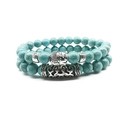 Handmade beaded bracelet set featuring blue turquoise stones and silver Buddha head charm - Turquoise