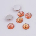 Macro detail of 7 orange round resin drusy stones with flat back for DIY jewelry making - 14mm / Orange