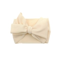 Beige baby headband with large waffle knit bow made of soft textured fabric - Off White
