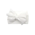 White infant headband with large bow detail and waffle knit texture on plain background - White