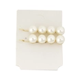 Pair of elegant white pearl hair clips with gold alloy base on a white display card - H184-4 (Cross Pearl)