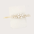 Detailed view of pearl hair clip with gold metal frame on white display card - H184-6 (Gradient Size Pearl)