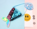 Close-up of sequin mermaid tail coin purse with reversible blue and purple sequins - Blue + Light Pink