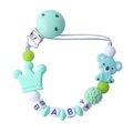 Detail of baby pacifier clip with mint green silicone koala, crown beads and wood clip - Green
