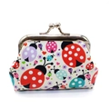 Close-up of a ladybug patterned mini coin purse featuring a vintage metal clasp closure - White