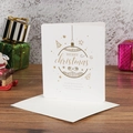 White Christmas card with gold foil ornament and matching envelope on desk - White Base Bell