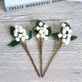 Three pieces of decorative white berries with green leaves and realistic stems on wooden surface - Small Leaf White Berry