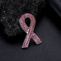 Pink ribbon breast cancer awareness brooch with shiny crystals on dark background - Pink Ribbon Bow