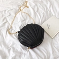 Mini black shell-shaped crossbody bag with gold chain strap and pearl zipper charm - Black