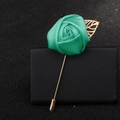 Elegant green satin rose brooch with gold leaf pin on black leather surface - Light Green