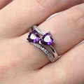 Elegant silver ring with double purple heart gemstones on a model hand - US 7 / Purple