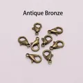 Macro detail of antique bronze lobster clasps for DIY jewelry and necklace making - Antique Bronze