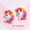Macro detail of glittery resin unicorn cabochons for DIY hair clips and shoe charms - 12#