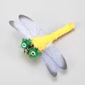 Yellow dragonfly feather cat teaser replacement head with transparent wings and bells - Dragonfly Style 11 / 【product Attributes】dragonfly-shaped Pet Toy The Main Body Is Made Of Bright Yellow Yarn Or Plush Material With Two Green Pom-pom Eyes On The Head Adorned With Sequins. The Wings Are Made Of Translucent Plastic Material Printed With Fine Blue Vein Patterns And The Overall Design Is Vivid. 【visual Presentation】the Image Is Taken Against A Simple Gray Background With Even Light And Shadow Distribution Extremely High Clarity Of The Subject And Full Expression Of Texture. Image Quality Is [high] Aesthetics Is Rated [medium] Score [7.8] Which Is A Standard Product Display Image. 【text Content】to_remove Includes The Style Number In The Upper Left Corner And The Chinese Marketing Text In The Lower Right Corner Which Should Be Removed. 【logistics Labels】none. 【infringement Risk】product Infringement: None Probability [0.0]. Background Infringement: None. 【product Parameters】only Style Number 11 Is Marked In The Image.