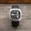 Macro detail of silver square dial with unique turntable time display and leather strap - Silver Case Black Strap White Dial