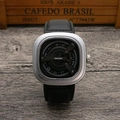 Macro view of square silver case with unique rotating disc dial and black leather strap - Silver Case Black Strap Black Dial