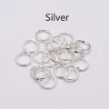 Macro shot of silver metal jump rings for DIY jewelry making and connecting accessories - Silver / 0.5*3mm/4g/pack/200 Pieces [wire Diameter*outer Diameter]