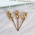 Three artificial gold berry branches for Christmas and wedding decor on wooden background - Gold Berry 6-Fruit Branch