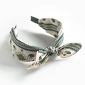 Retro bow headband in cream fabric with green and yellow floral geometric patterns - Pink Scarf Print Bow