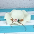 Women's foldable wide brim straw sun hat in cream with pink floral and bow accents - Adult M / Creamy White