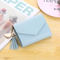 Sky blue envelope style small wallet featuring a leather tassel and gold heart charm - Light Blue