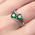 Silver color double green heart-shaped gemstone ring with micro-pave accents on finger - US 6 / Emerald