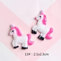 Detail of white resin unicorn DIY charm with pink glitter and purple horn, size 2.1x2.3cm - 13#
