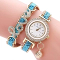 Detailed close-up of light blue and gold quartz watch with LOVE crystal bracelet on wrist - Blue (QS2512-017-03)