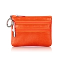 Macro shot of orange lychee grain leather wallet with three zippers and a key ring - Orange