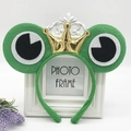 Green plush frog headband with a golden crown and large cartoon eyes for kids' roleplay - Green Frog with Golden Crown